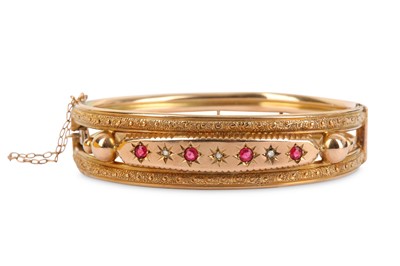 Lot 327 - A hinged bangle, inset to the front with...