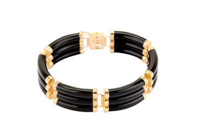 Lot 317 - An onyx bracelet, each onyx baton set links,...