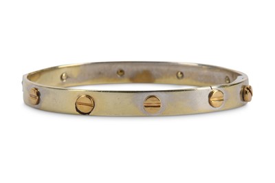 Lot 374 - A bangle, decorated with screwhead motifs,...