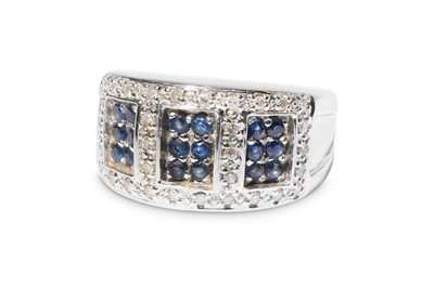 Lot 319 - A sapphire and diamond dress ring, Set with...