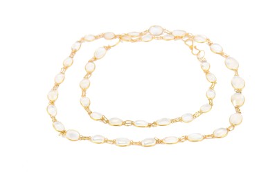 Lot 332 - A moonstone necklace, spectacle-set with a...