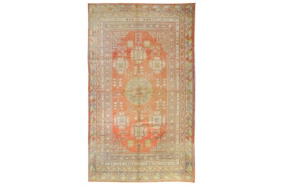 Lot 23 - AN ANTIQUE KHOTAN CARPET, EAST TURKESTAN...