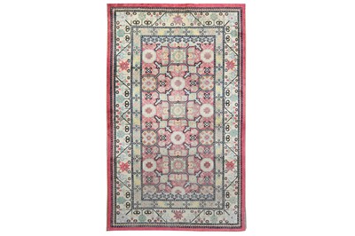 Lot 26 - AN ANTIQUE SILK KHOTAN RUG, EAST TURKESTAN...