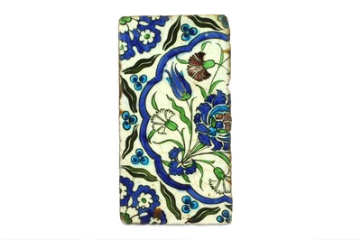 Lot 114 - AN IZNIK POTTERY TILE WITH CINTAMANI AND FLORAL MOTIVES