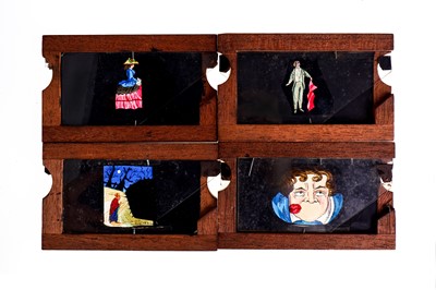 Lot 341 - A GROUP OF HAND PAINTED MAHOGANY MAGIC LANTERN...