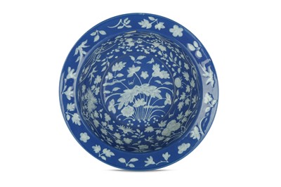 Lot 463 - A CHINESE POWDER-BLUE AND SLIP-DECORATED BASIN.