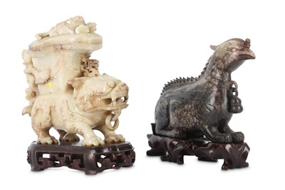 Lot 711 - TWO CHINESE CHICKEN BONE JADE 'MYTHICAL BEAST' CARVINGS.
