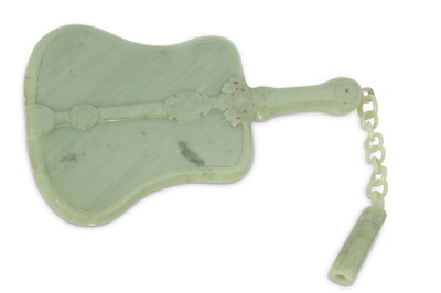 Lot 567 - A CHINESE PALE CELADON JADE FAN.