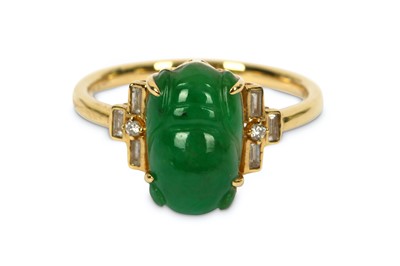 Lot 202 - A jadeite jade and diamond ring, the carved...