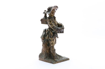 Lot 329 - A BRONZE FIGURINE OF AN ITINERANT MAGIC...