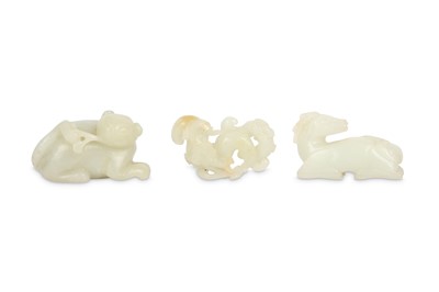 Lot 245 - THREE CHINESE PALE CELADON CARVINGS.