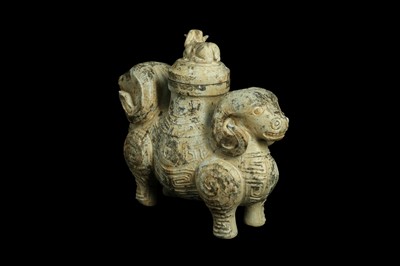 Lot 488 - A CHINESE JADE ARCHAISTIC 'DOUBLE RAM' VASE