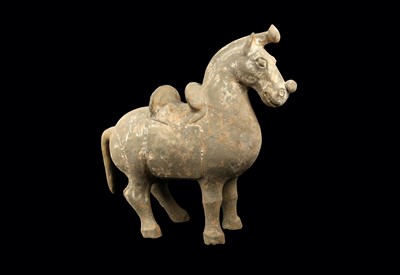 Lot 415 - A CHINESE POTTERY MODEL OF A SADDLED HORSE