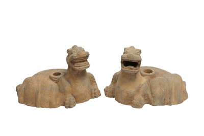 Lot 158 - A PAIR OF CHINESE POTTERY 'MYTHICAL BEASTS' CANDLESTICKS.