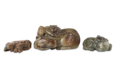 Lot 494 - THREE CHINESE PALE CELADON JADE 'OX' CARVINGS.
