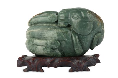 Lot 496 - A CHINESE CELADON JADE CARVING OF A HORSE