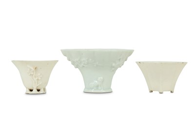 Lot 310 - THREE CHINESE BLANC-DE-CHINE LIBATION CUPS.