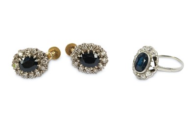 Lot 201 - A sapphire and diamond cluster ring and...