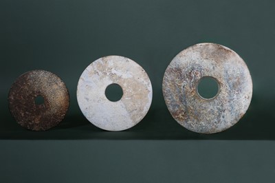 Lot 111 - THREE CHINESE JADE BI DISKS.