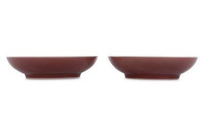 Lot 651 - A PAIR OF CHINESE RED-GLAZED DISHES.