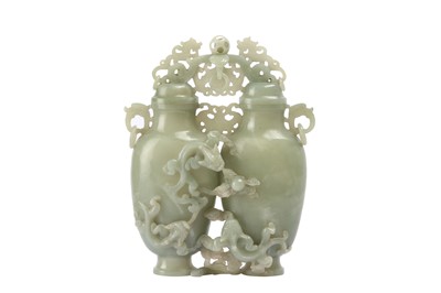 Lot 295 - A CHINESE PALE CELADON JADE DOUBLE 'CHILONG' VASE.