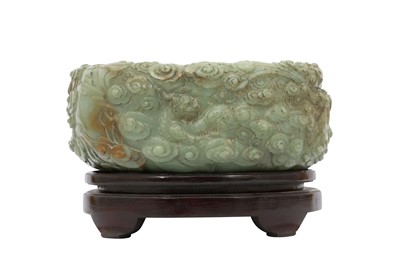 Lot 780 - A CHINESE PALE CELADON JADE 'DRAGON' BRUSH WASHER.