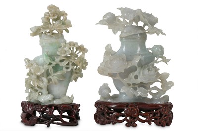 Lot 359 - TWO CHINESE APPLE-GREEN JADEITE 'BIRDS AND FLOWERS' VASES AND COVERS.