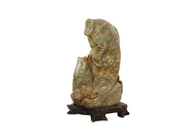 Lot 507 - A CHINESE PALE CELADON JADE 'TWIN FISH' CARVING, 20TH CENTURY