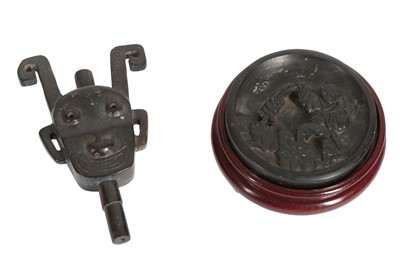 Lot 704 - A CHINESE INK STONE AND A JADE PENDANT.