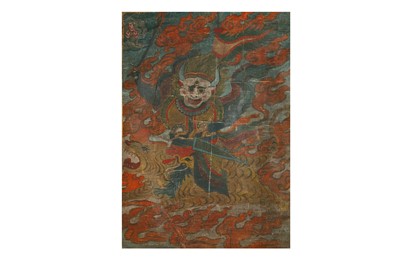 Lot 404 - A TIBETAN THANGKA OF A BUDDHIST GUARDIAN.