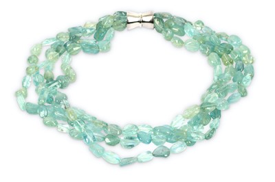 Lot 203 - An aquamarine bead torsade, composed of four...