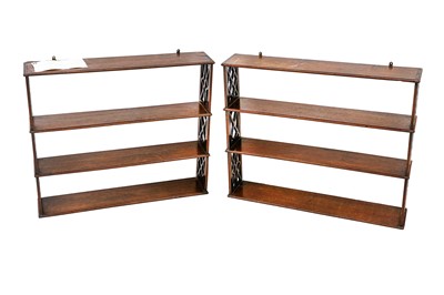Lot 419 - A pair of George III mahogany hanging shelves...