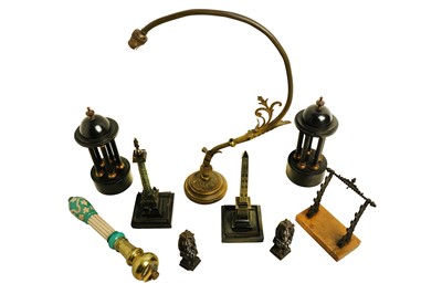Lot 396 - A Victorian bronze pen stand, on variegated...