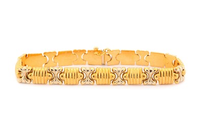 Lot 9 - A fancy-link bracelet, of bi-coloured...