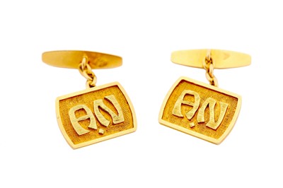 Lot 16 - A pair of cufflinks, each tonneau-shaped...
