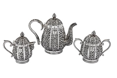 Lot 295 - An early 20th century Anglo-Indian Raj unmarked silver three-piece tea set, Karachi circa 1911