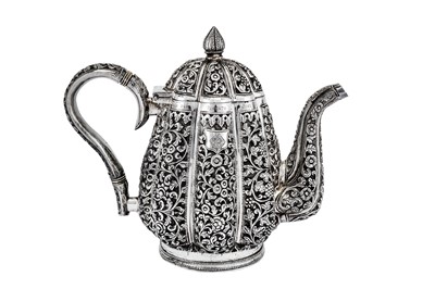 Lot 295 - An early 20th century Anglo-Indian Raj unmarked silver three-piece tea set, Karachi circa 1911