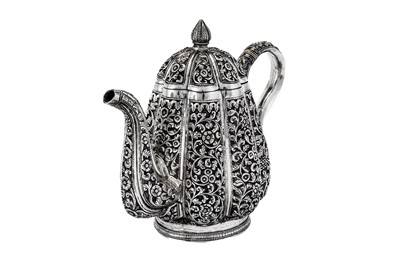 Lot 295 - An early 20th century Anglo-Indian Raj unmarked silver three-piece tea set, Karachi circa 1911