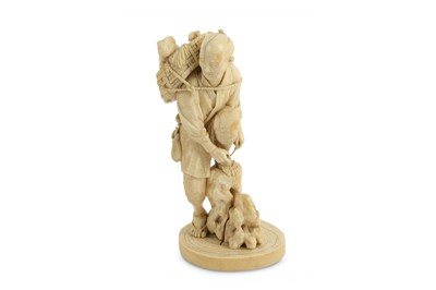 Lot 226 - A 19th Century Japanese ivory okimono of a man...