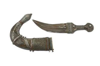 Lot 120 - AN OMANI SILVER-MOUNTED JAMBIYA DAGGER