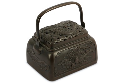 Lot 225 - A Japanese cast bronze hand warmer with a...
