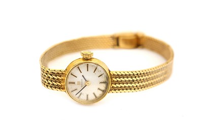 Lot 56 - TISSOT. A LADIES 18K YELLOW GOLD MANUAL...