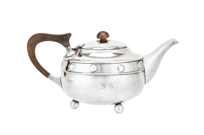 Lot 526 - A George V sterling silver ‘arts and crafts’ teapot, Birmingham 1923 by A. E. Jones