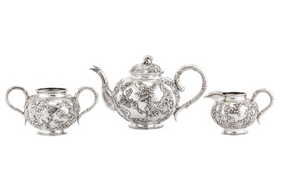 Lot 249 - An early 20th century Chinese export silver three-piece tea service, Shanghai circa 1910 retailed by Luen Hing