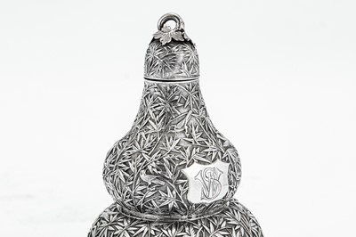 Lot 247 - A mid to late 19th century Chinese export silver double gourd tea caddy or wine bottle, Canton circa 1870 retailed by Cum Shing