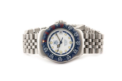 Lot 54 - TAG HEUER. A STAINLESS STEEL QUARTZ BRACELET...