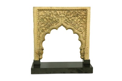 Lot 211 - A YELLOW SANDSTONE DOORWAY ARCH
