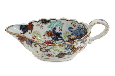 Lot 113 - A CHINESE FAMILLE ROSE 'TOBACCO LEAF' SAUCE BOAT.