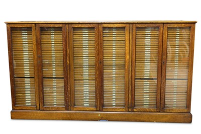 Lot 489 - Baird & Tatlock (London) Ltd: An early 20th Century oak collectors cabinet
