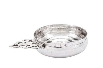 Lot 511 - A Queen Anne Britannia standard silver one handled porringer, London 1702 by John Cory (reg. April 1697)